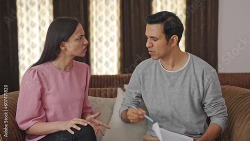 Angry Indian couple signing a divorce paper