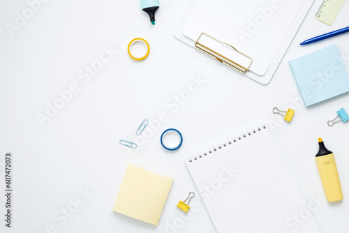 Mockup notebooks and set of stationery for work and study on white background. Back to school. Top view, flat lay, copy space