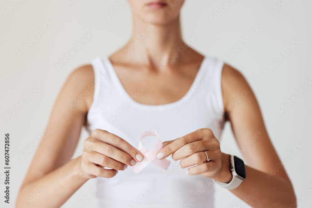 Woman with pink ribbon symbol of breast cancer awareness month. Woman with pink ribbon symbol of breast cancer awareness month.