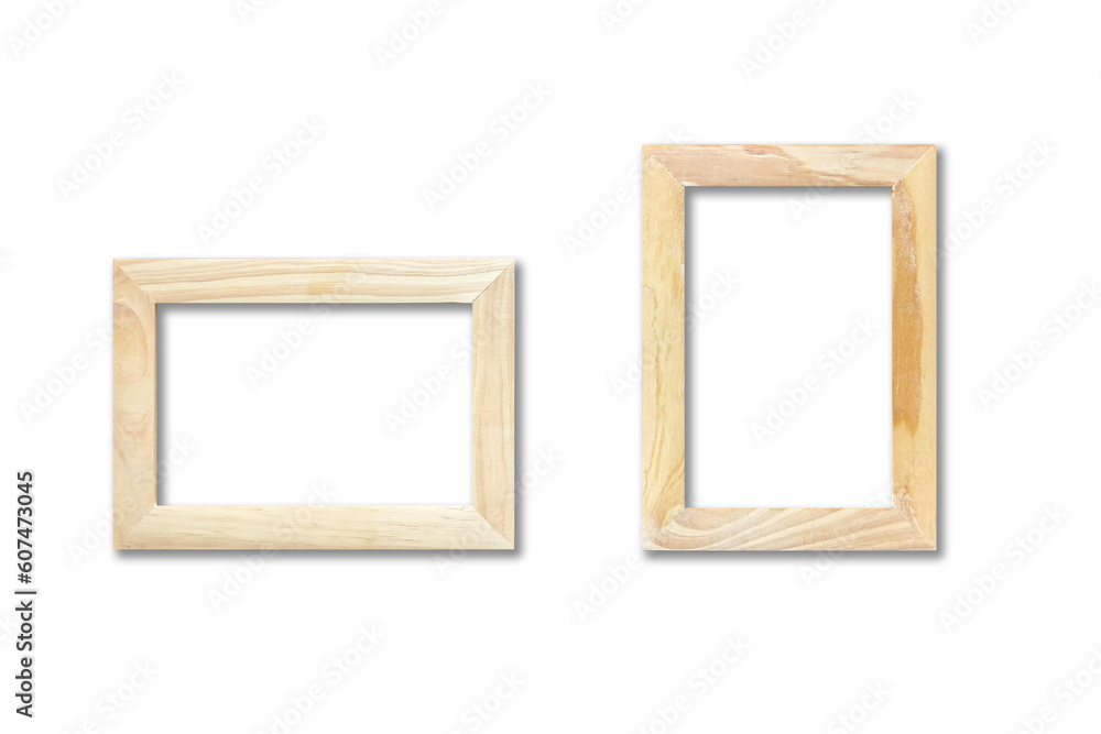 Two wooden picture frames hanging on a white wall Two wooden picture frames hanging on a white wall