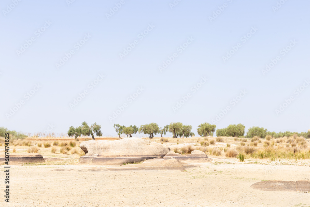 View of desert landscape due to lack of water. On rocks you can see mark of water level. View of desert landscape due to lack of water. On rocks you can see mark of water level.