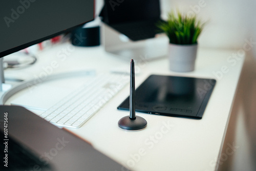 A table in a home studio. Graphics tools. Graphic designer or photographer studio.