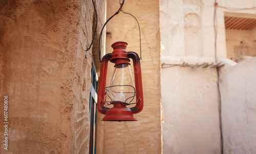 Al seef old historical district with traditional Arabic architecture. Vintage Lamp hanging outside the Al Seef Heritage Hotel, Dubai. photo