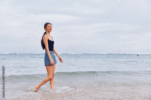 woman running sunset summer hair long beach lifestyle travel smile young sea