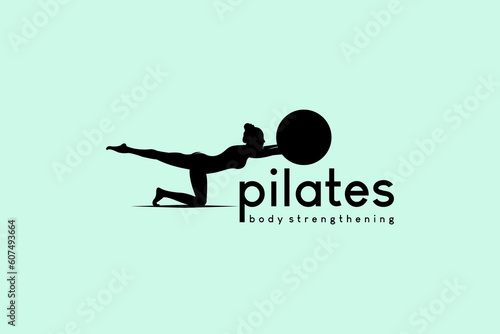 Pilates logo design with silhouette of woman lifting one leg and focus holding yoga ball