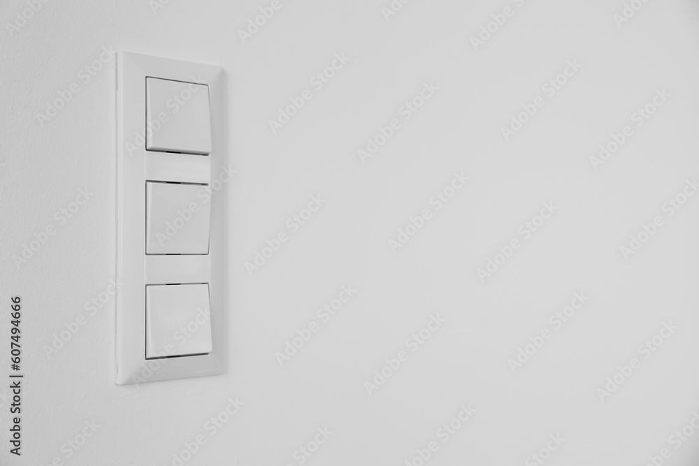 Modern switches on white wall Modern switches on white wall