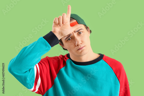 Upset young man showing los...