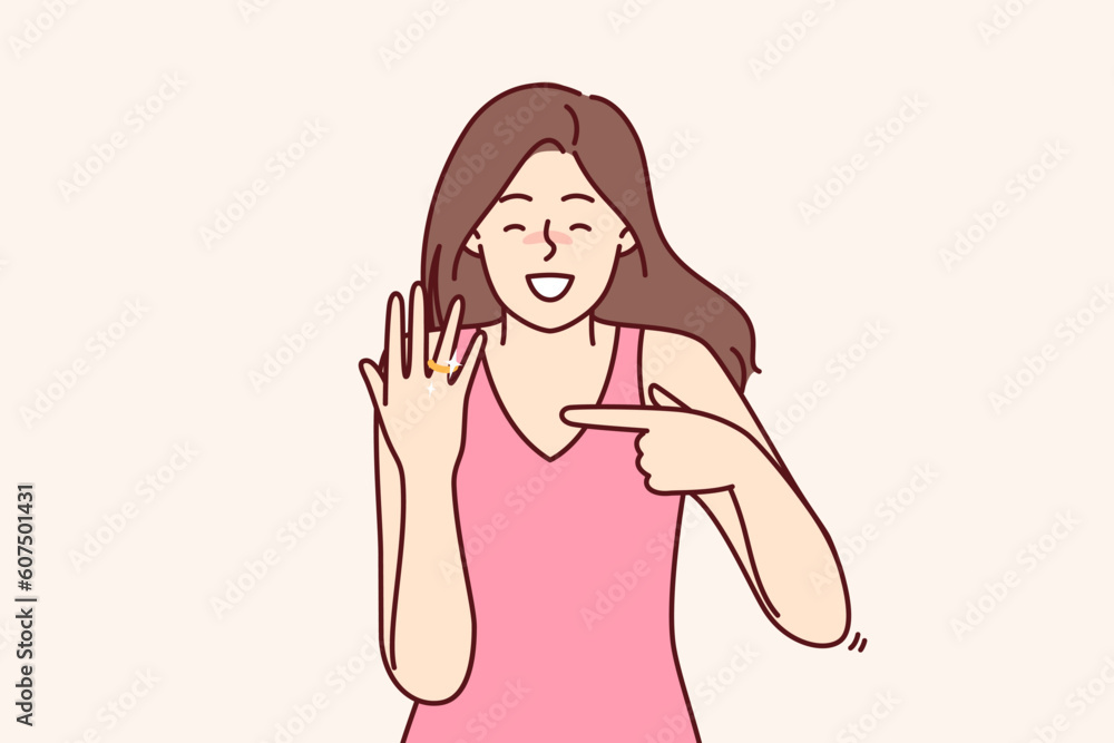 Happy bride with wedding ring shows off gift from groom and rejoices at proposal to get married. Woman with smile demonstrates wedding ring on finger for concept of successful marriage