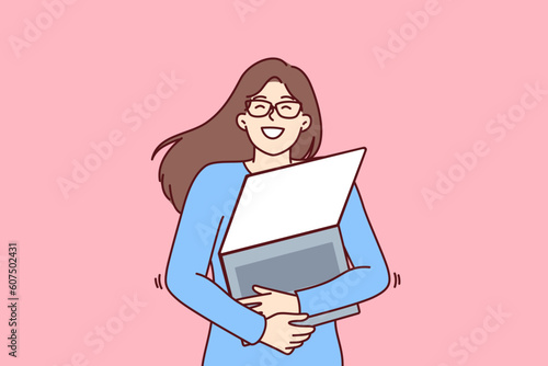 Geek woman with laptop hugs favorite gadget with blank screen rejoicing at opportunity to learn via internet. Young geek girl loves computers and is well versed in modern technologies.