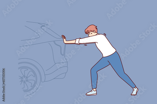Man pushing broken car on road needs help of professional auto mechanic or tow truck for transport. Young unfortunate driver has difficulty pushing car due to broken engine or punctured tire