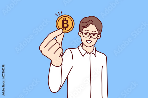 Man trader with bitcoin coin calls for mining or investing in cryptocurrency and blockchain technology. Guy in glasses and formal wear recommends buying bitcoin money for anonymous or secure payments