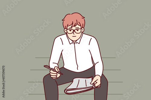 Unemployed man with newspaper is looking for vacancies while sitting on park bench. Unemployed guy in formal wear chooses places to send resume and sign up for interview with recruiter