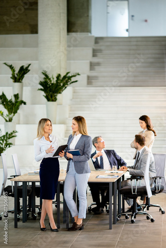 Two young business women lo...