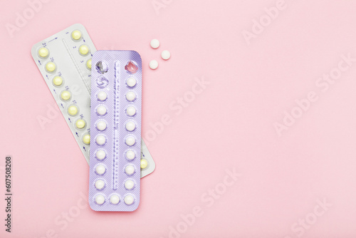 Oral contraceptive pills on pink background