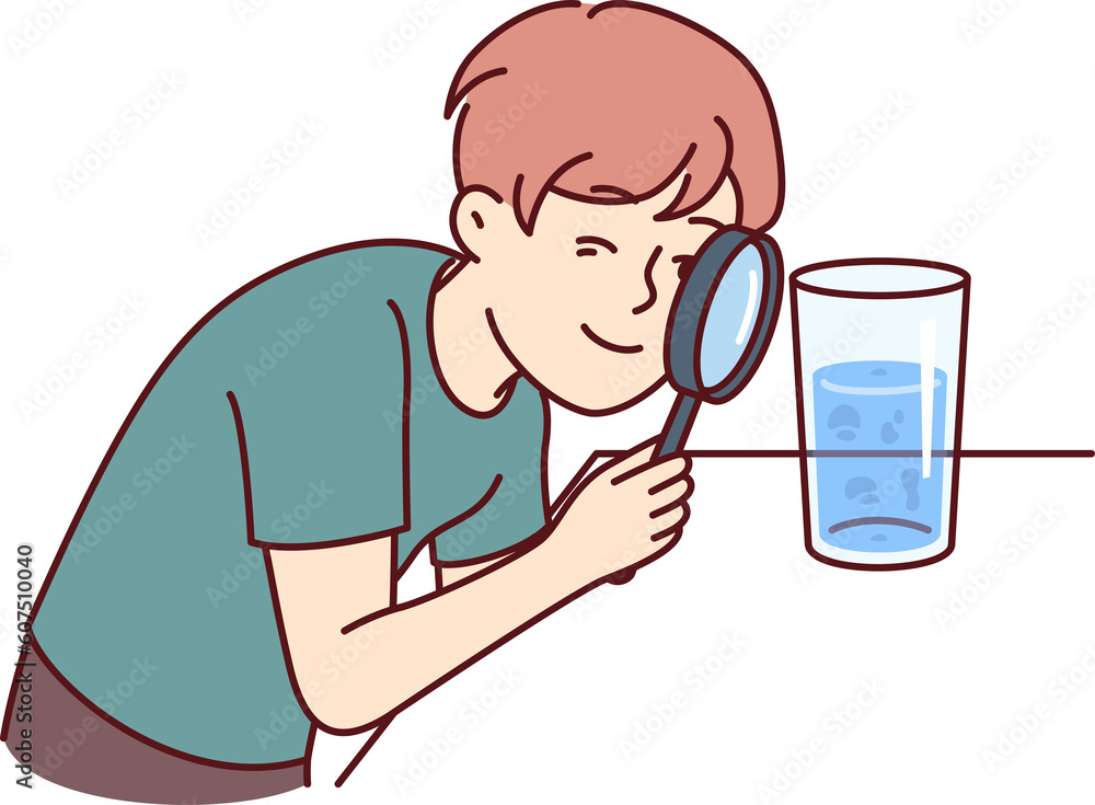 Small boy examines water in glass through magnifying glass, studying chemical composition liquid Small boy examines water in glass through magnifying glass, studying chemical composition liquid