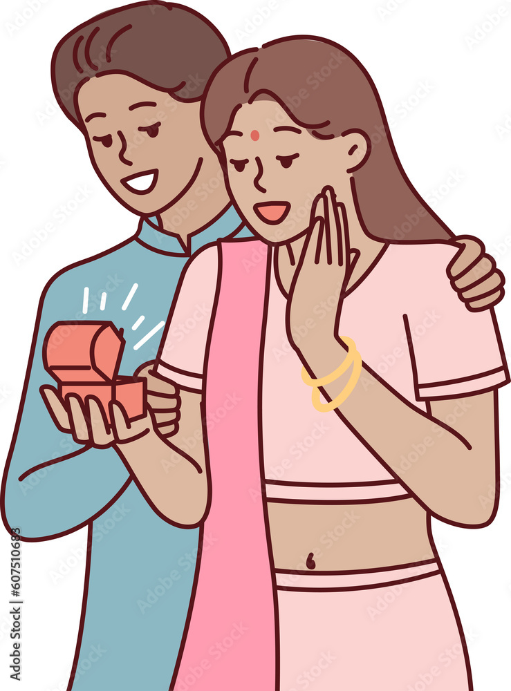Indian man surprises wife with box of jewelry or engagement ring as token of love and devotion Indian man surprises wife with box of jewelry or engagement ring as token of love and devotion