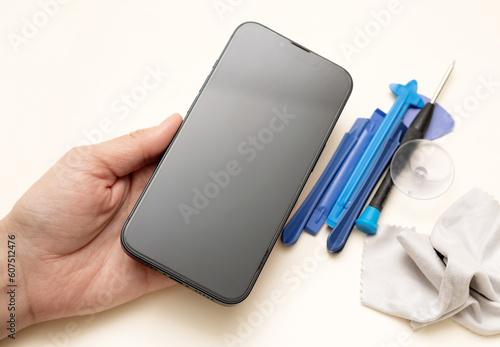 Wallpaper Mural glass film change,repair and maintenance smartphone.hand in glove holding screen protection.flying in air tempered glass and phone.medical stethoscope meaning mobile doctor.tools and display napkin Torontodigital.ca