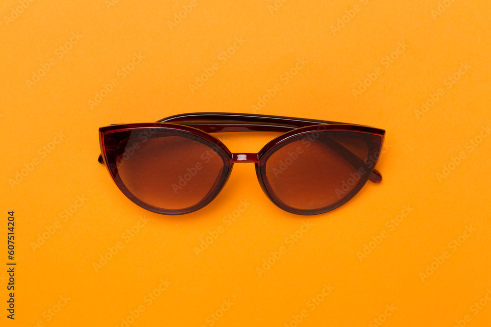 Sunglasses on color background, top view. Sunglasses on color background, top view.