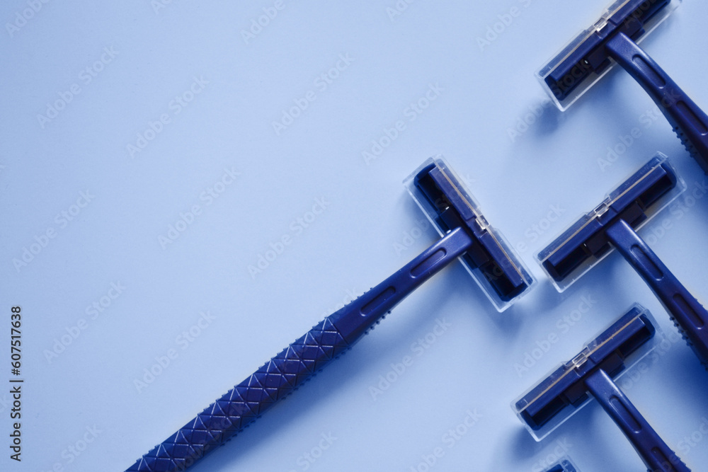 disposable machines on a blue background, hair removal, shaving and epilation, shaving machine, razor, template for text, banner disposable machines on a blue background, hair removal, shaving and epilation, shaving machine, razor, template for text, banner
