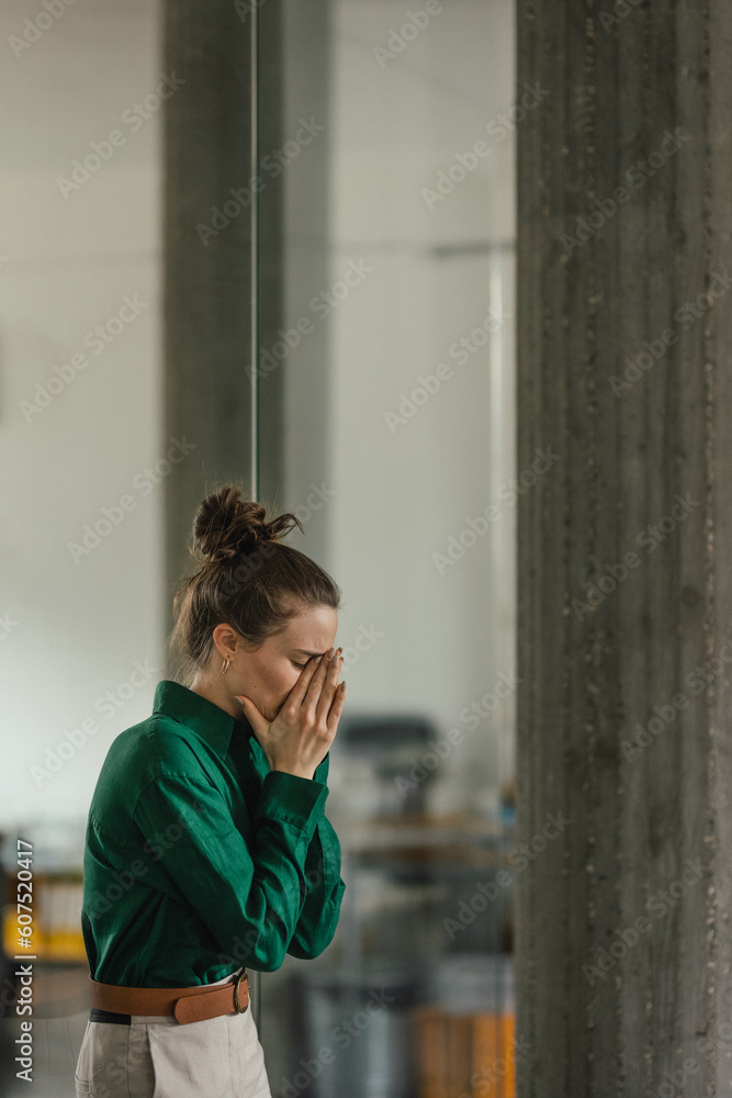 Young sad woman in office, having problem. Young sad woman in office, having problem.