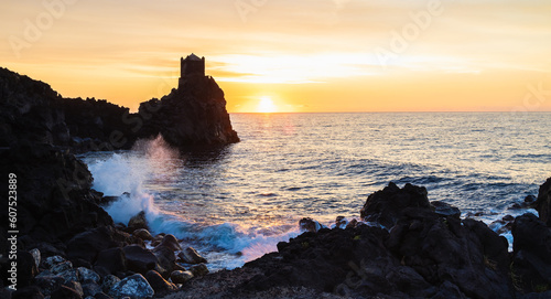 Torre Saracena dawn old tower, Santa Tecla, Sicily. Sea and sunrise photo