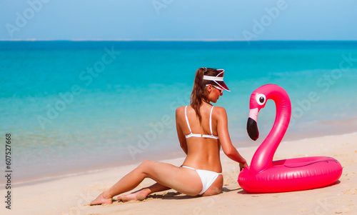 Tanned woman in bikini in Jumeirah, Dubai, UAE. Sand beach and sea © oleg_p_100