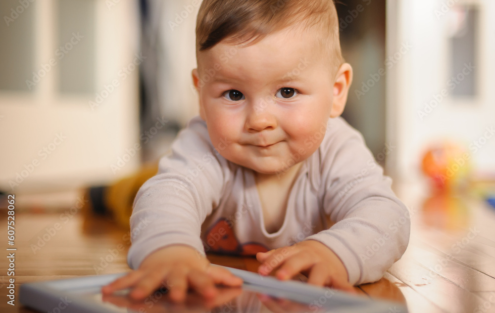 Cute baby boy crawls on the home floor, explore the world and learn to move. Love and family emotion Cute baby boy crawls on the home floor, explore the world and learn to move. Love and family emotion