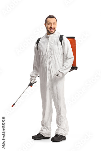 Full length shot of a pest control worker in a white suit holding a sprayer © Ljupco Smokovski