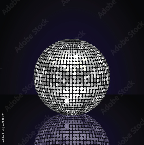 Metallic silver disco ball reflected on a blue shiny surface © Designpics