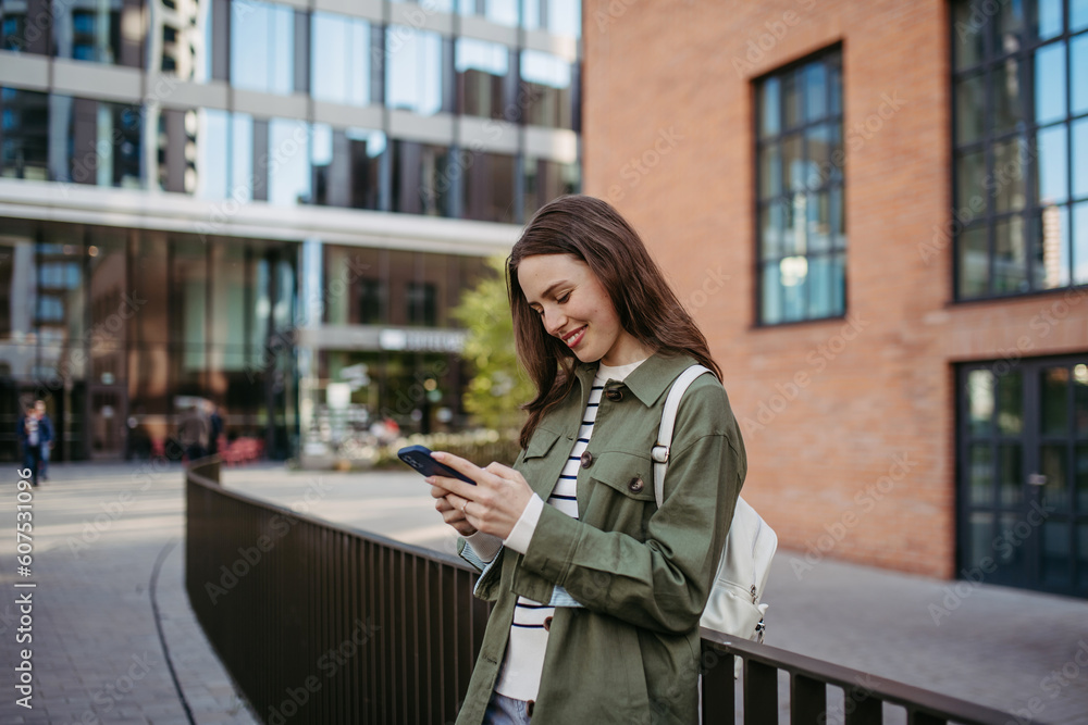 Portrait of young woman in a city. Portrait of young woman in a city.