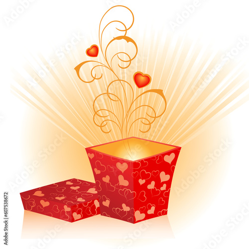 An open gift box from red wrapping with hearts
