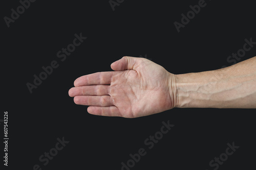 Man`s hand close up on a black background