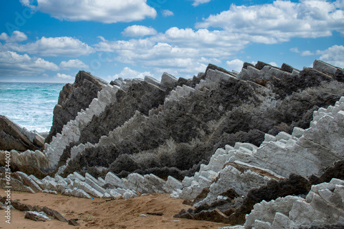 Spectacular view of the flysch geological phenomenon, on Itzurun beach, Guipuzcua, Spain photo