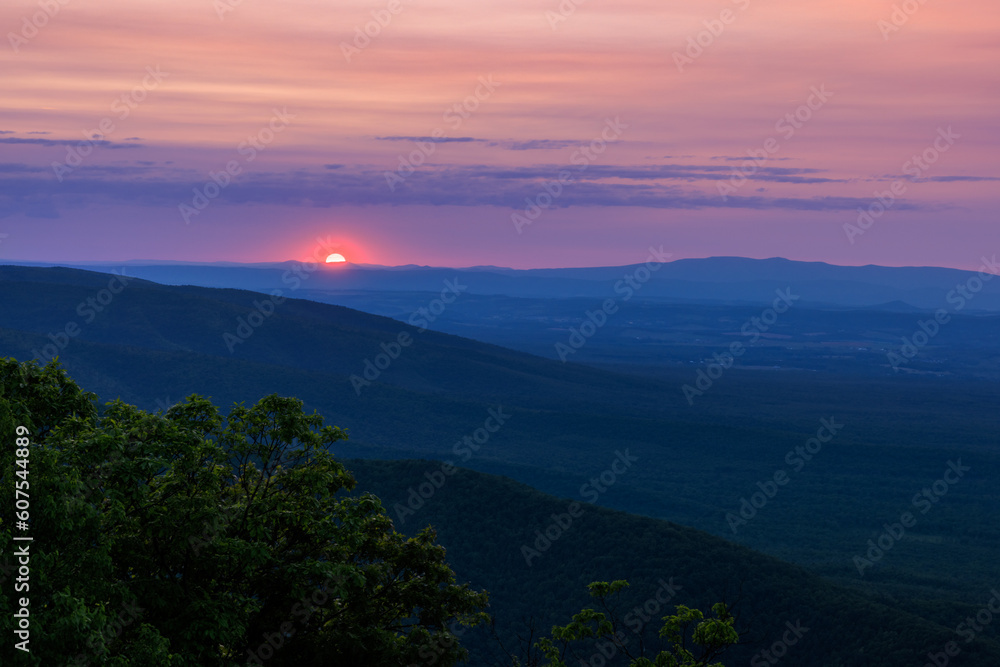 Hazy red sunset over the Shenandoah Valley in Blue Ridge Mountains Virginia Hazy red sunset over the Shenandoah Valley in Blue Ridge Mountains Virginia