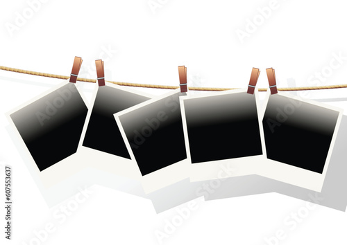 Polaroid templates hanged on a rope over white background