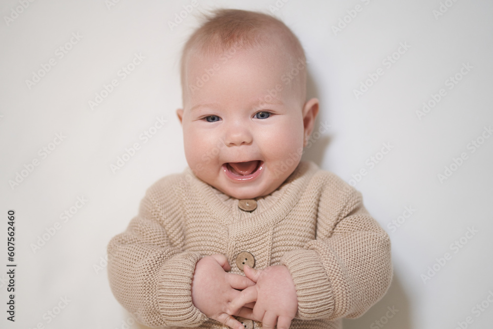 portrait of a smiling child on a light background portrait of a smiling child on a light background