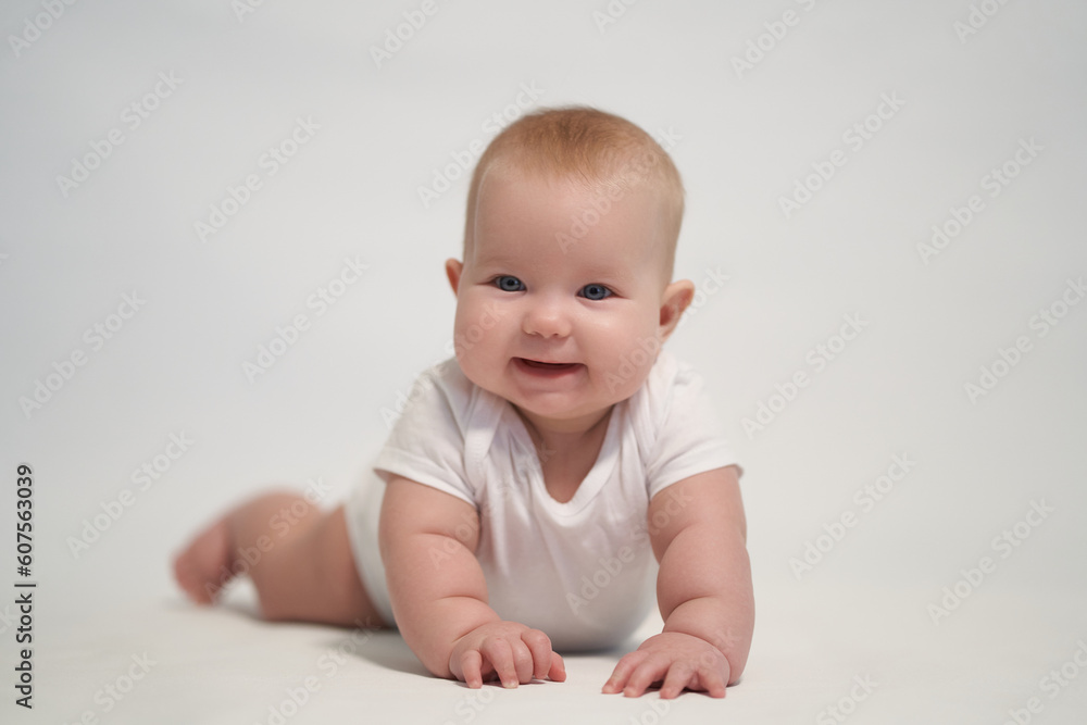 Smiling newborn baby. the photo was taken against a light background Smiling newborn baby. the photo was taken against a light background