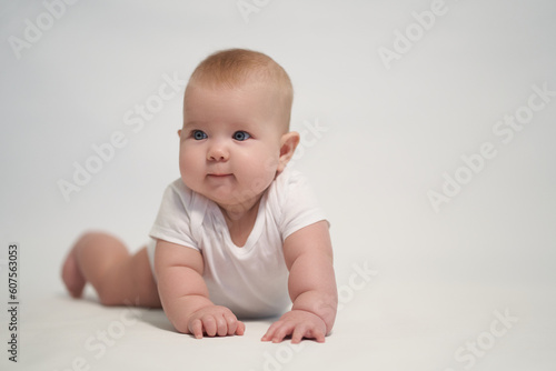 Smiling newborn baby. the photo was taken against a light background