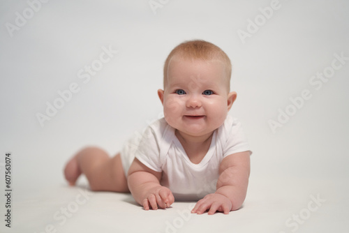 Smiling newborn baby. the photo was taken against a light background
