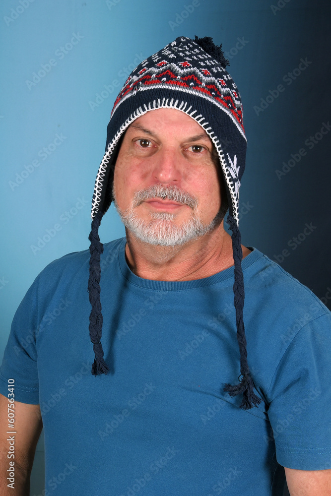 happy bald man with white beard Peruvian cap on his head looking forward with good expression happy bald man with white beard Peruvian cap on his head looking forward with good expression