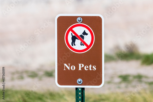 Sign indicating no pets allowed in the Badlands National Park.
