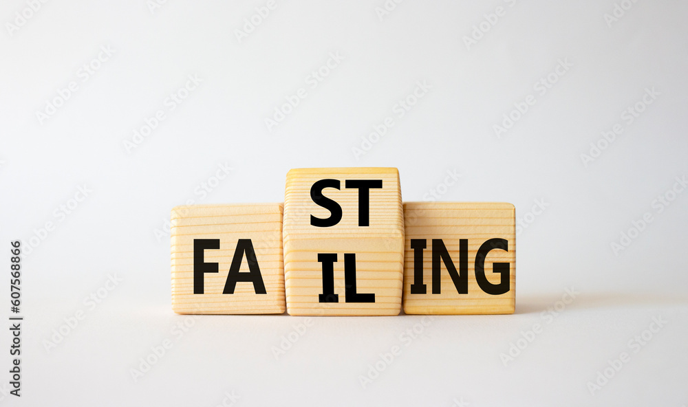 Fasting vs Failing symbol. Wooden cubes with words Failing and Fasting. Beautiful white background. Fasting vs Failing and business concept. Copy space Fasting vs Failing symbol. Wooden cubes with words Failing and Fasting. Beautiful white background. Fasting vs Failing and business concept. Copy space