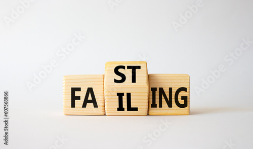 Fasting vs Failing symbol. Wooden cubes with words Failing and Fasting. Beautiful white background. Fasting vs Failing and business concept. Copy space