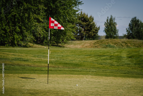 red and white checkered flag in golf course