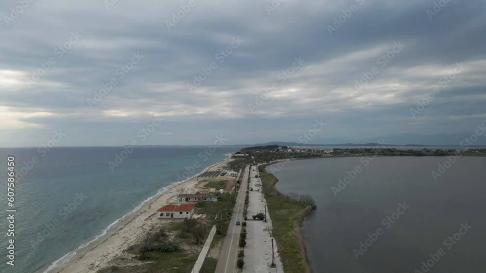 Aerial view of Fanari beach, a long stripe of land between Limnothalassa Ksirolimnis Lake and the Thracian Sea, East Macedonia and Thrace, Greece. Aerial view of Fanari beach, a long stripe of land between Limnothalassa Ksirolimnis Lake and the Thracian Sea, East Macedonia and Thrace, Greece.