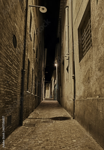 Rimini  Emilia Romagna  Italy  dark narrow alley at night in the old town of the Italian city on the Adriatic sea coast