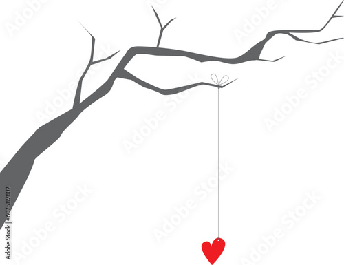 heart hanging from a string on a branch