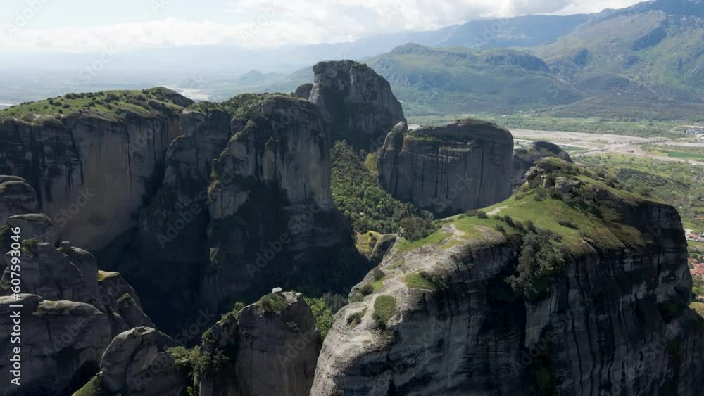 Aerial view of the landscape of Meteora unique rock formations with Kalabaka town in background, Trikala, Thessaly, Greece. Aerial view of the landscape of Meteora unique rock formations with Kalabaka town in background, Trikala, Thessaly, Greece.