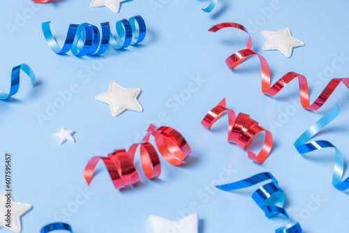 USA Independence day concept. Red and blue spirals and white stars elements of USA flag on blue background. Variative focus. photo