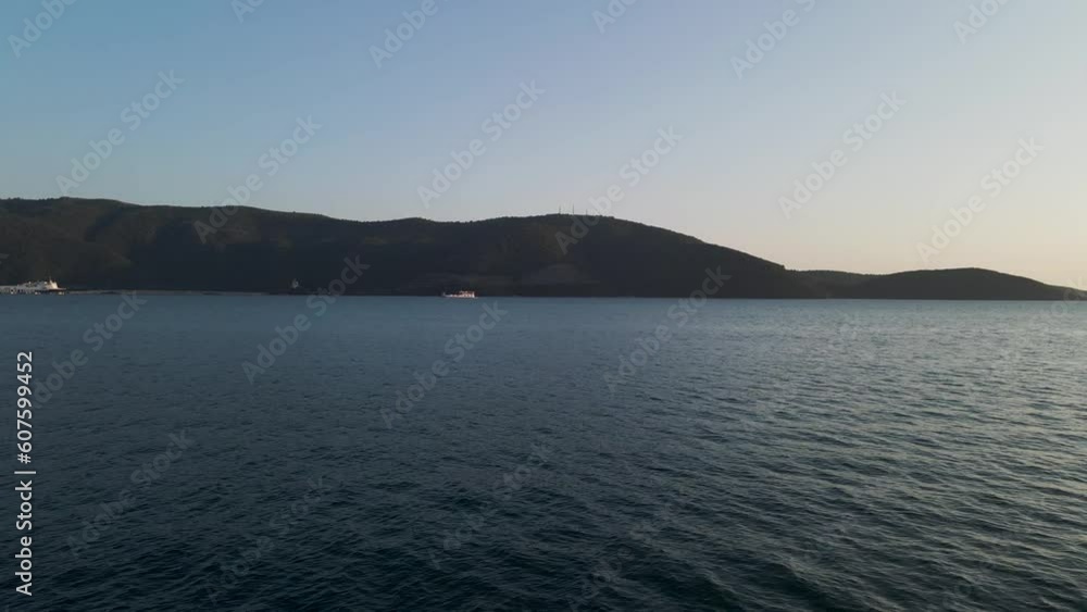 Aerial view of Igoumenitsa promontory at sunset along the Ionian Sea, Epirus, Greece. Aerial view of Igoumenitsa promontory at sunset along the Ionian Sea, Epirus, Greece.